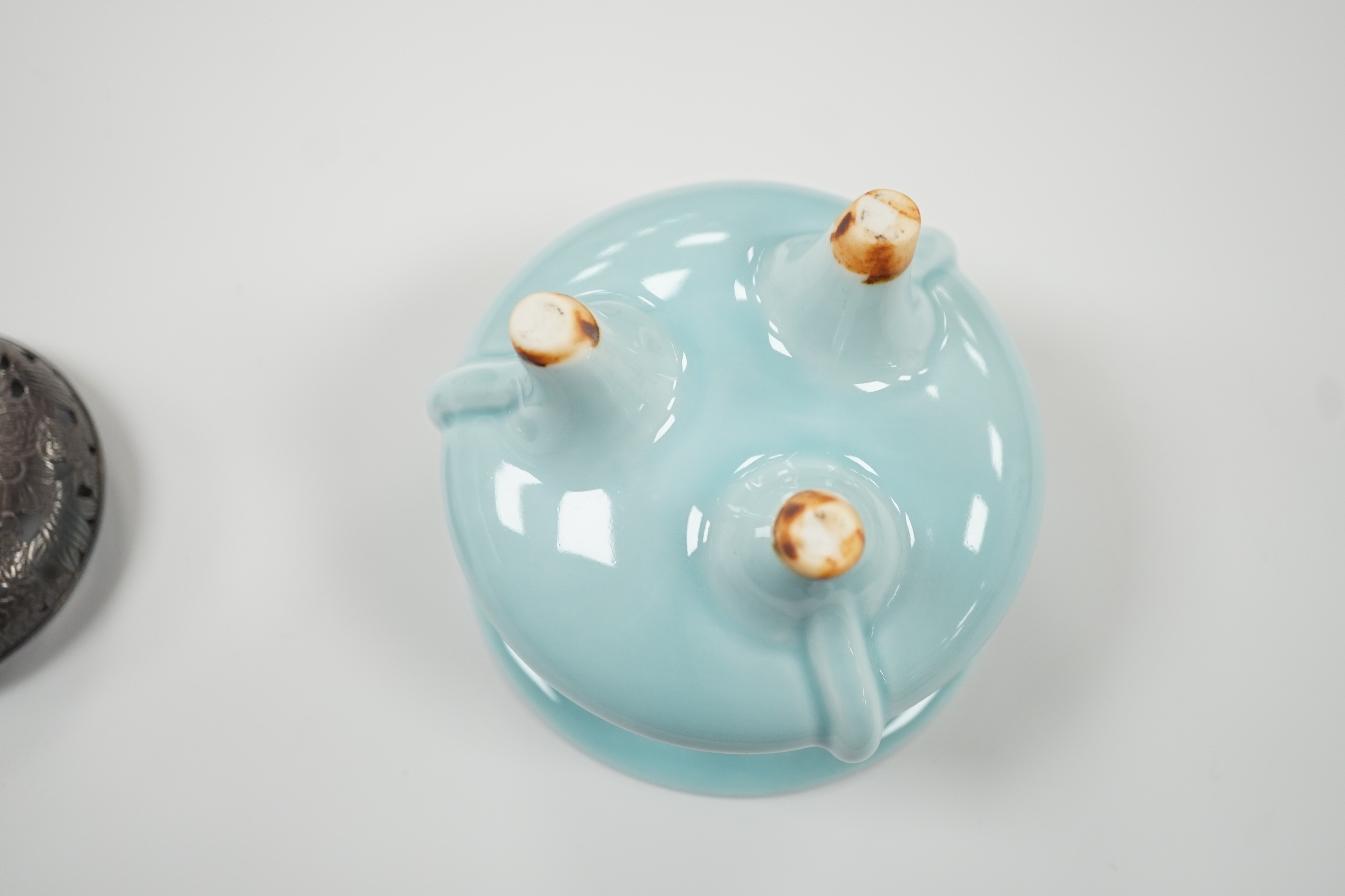 A Chinese tripod censer with white metal cover, Chinese mark. 9cm tall